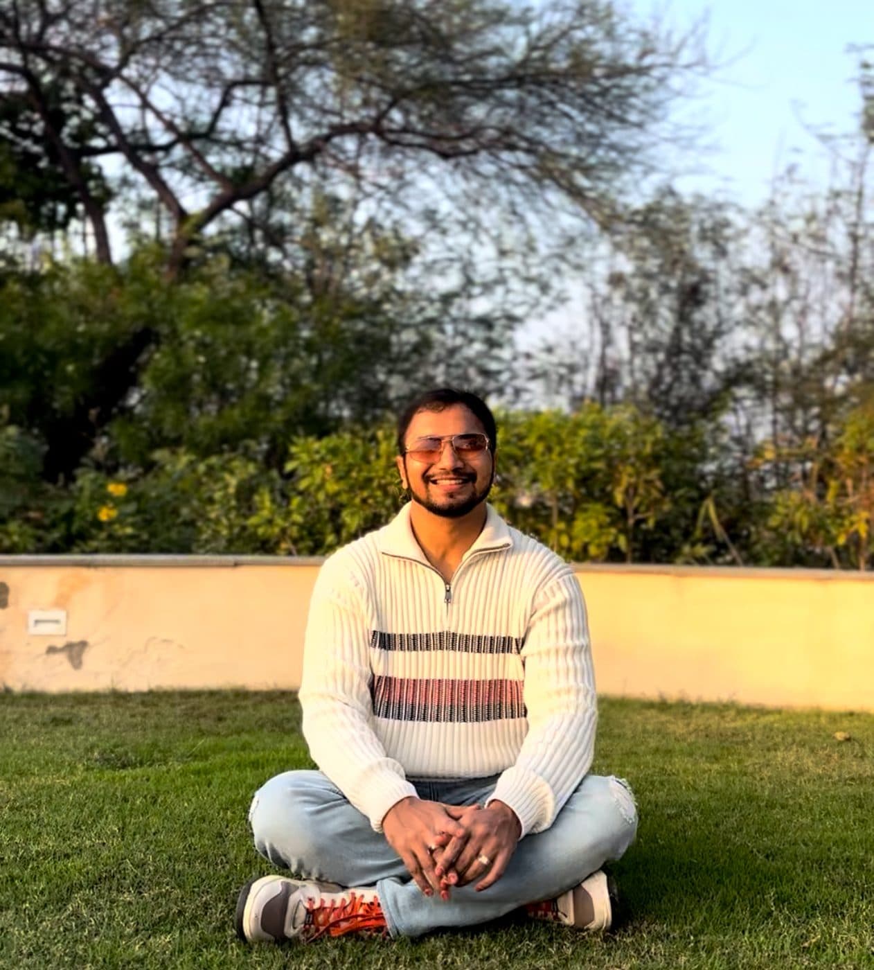 Adarsh Dumrewal sitting outdoors